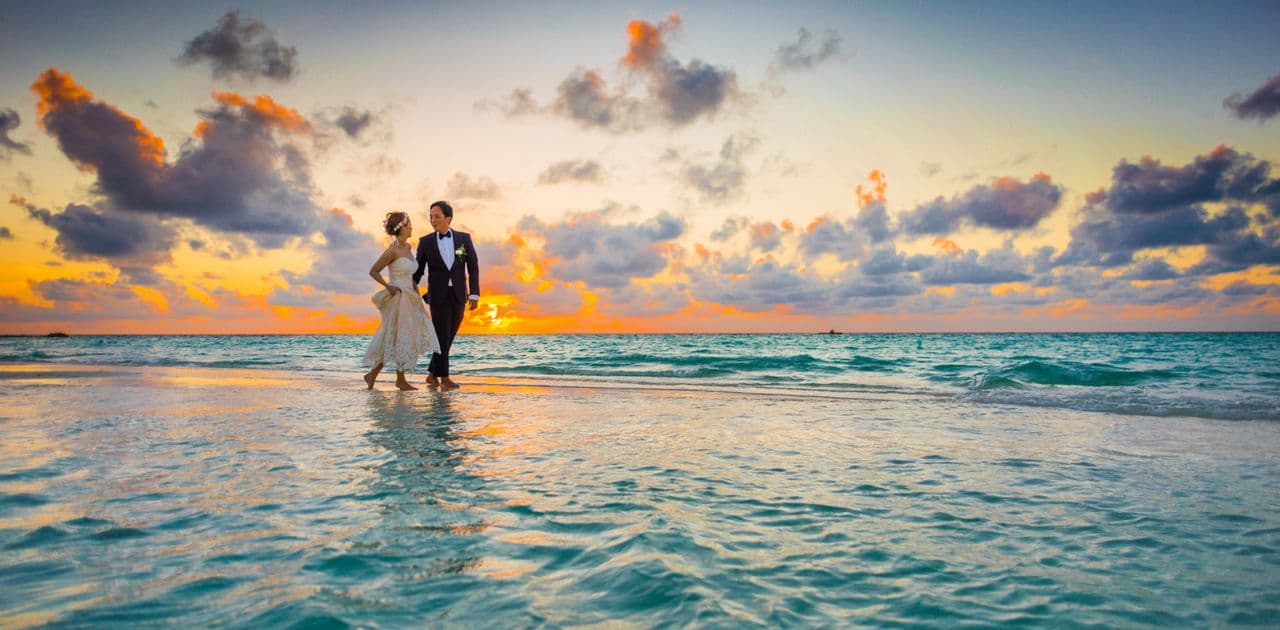 Couple reviewing a digital wedding invitation together — are digital wedding invitations tacky?