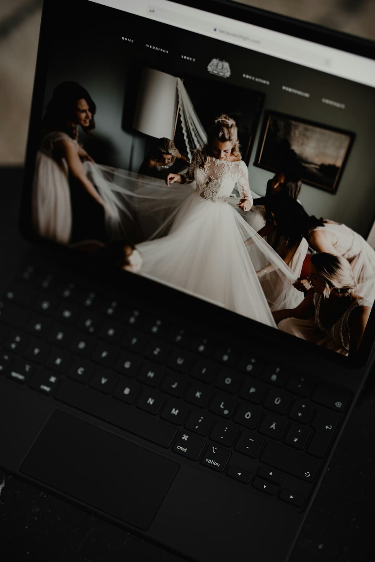 Digital wedding invitation website viewed on a tablet showing bride photo