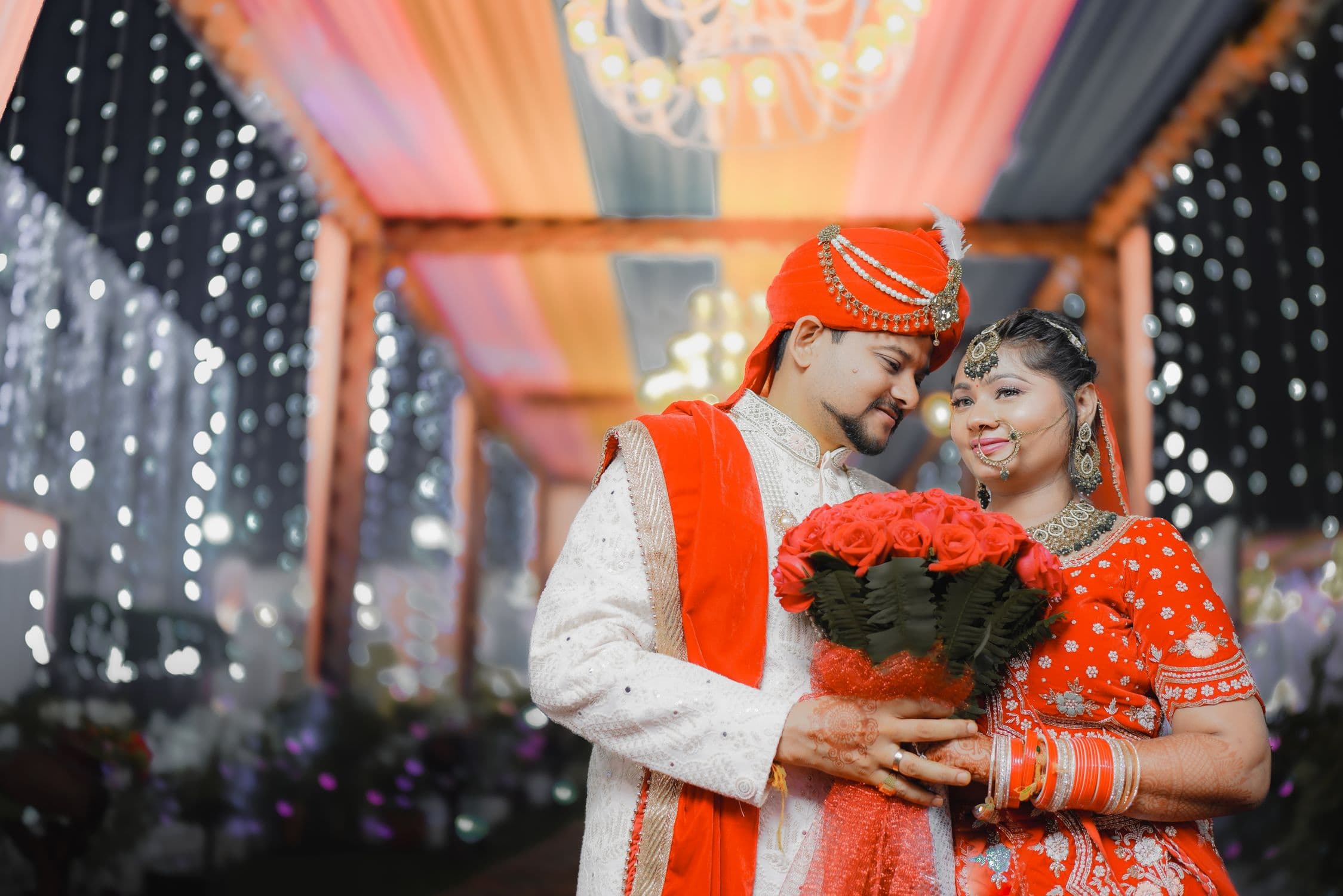 Indian wedding couple under decorated mandap during traditional ceremony