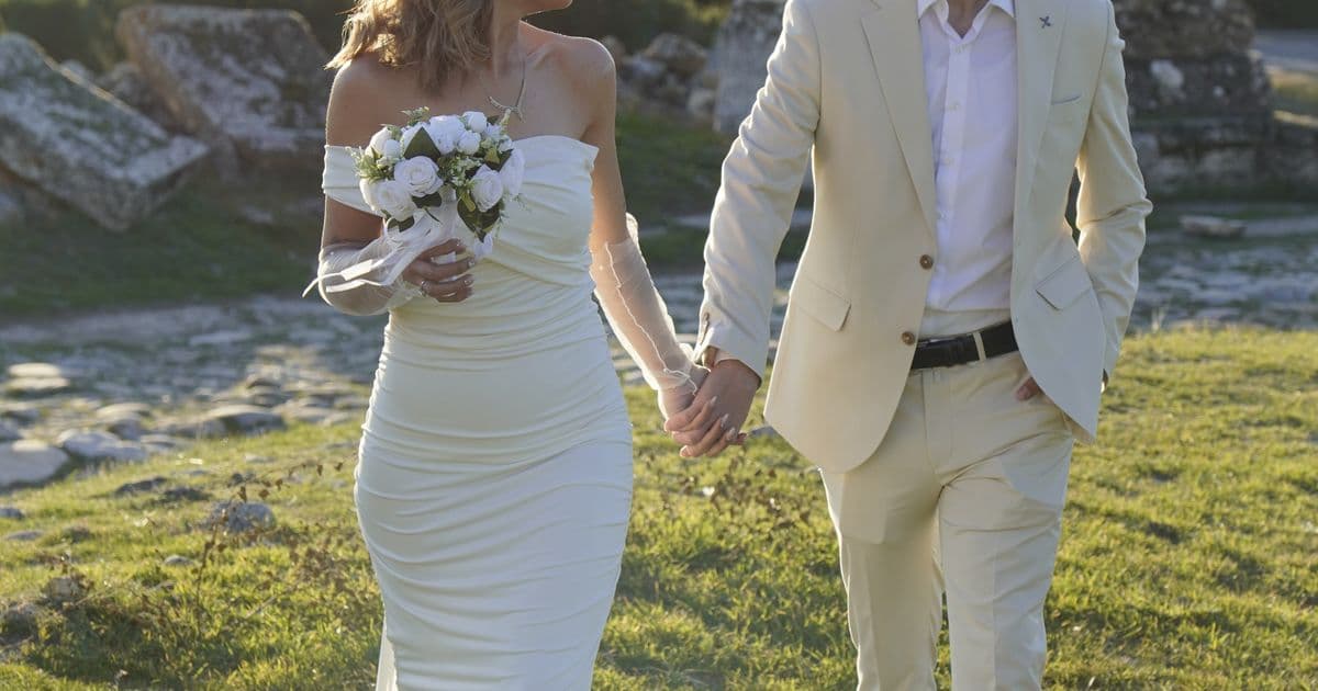 Wedding couple at a European destination venue for a multilingual wedding invitation