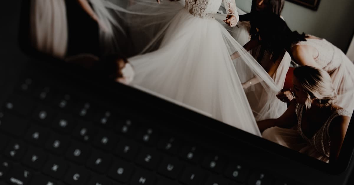 Online wedding invitation maker showing a wedding website on a laptop screen