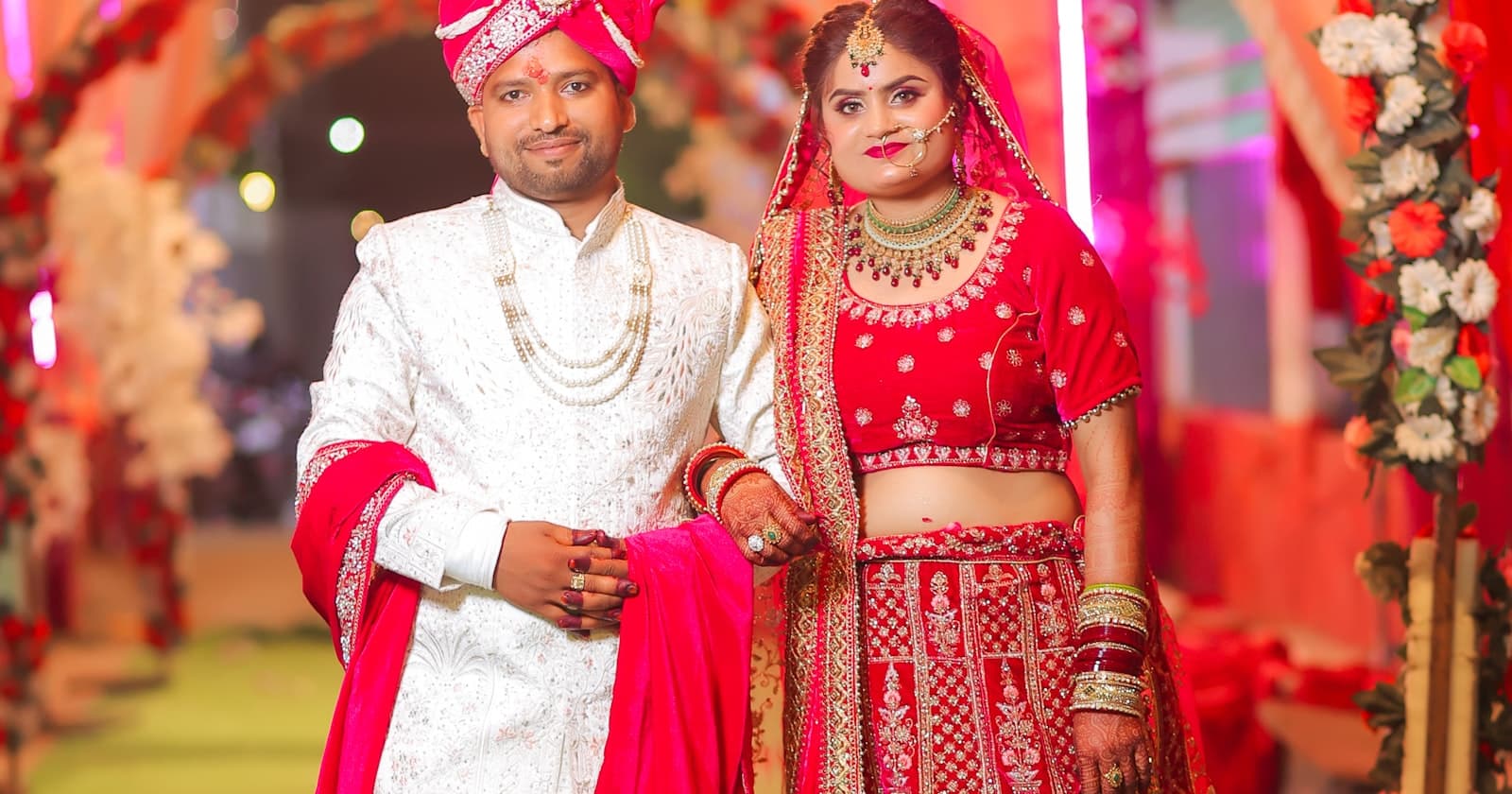 Indian wedding couple in traditional attire comparing Vow Invites vs NIMNTRN digital wedding invites