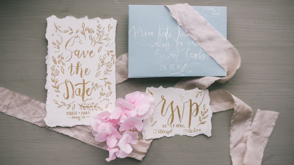 Elegant save the date invitation card on a table — formal wedding stationery