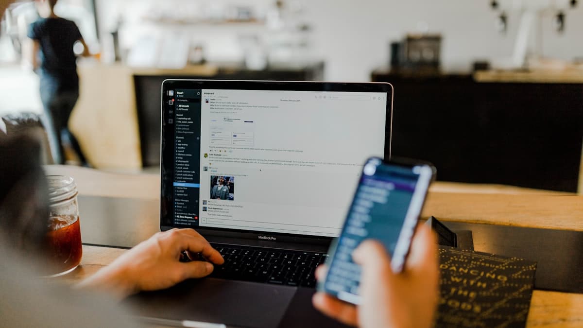 Laptop showing email inbox with wedding invitation subject line and preview text