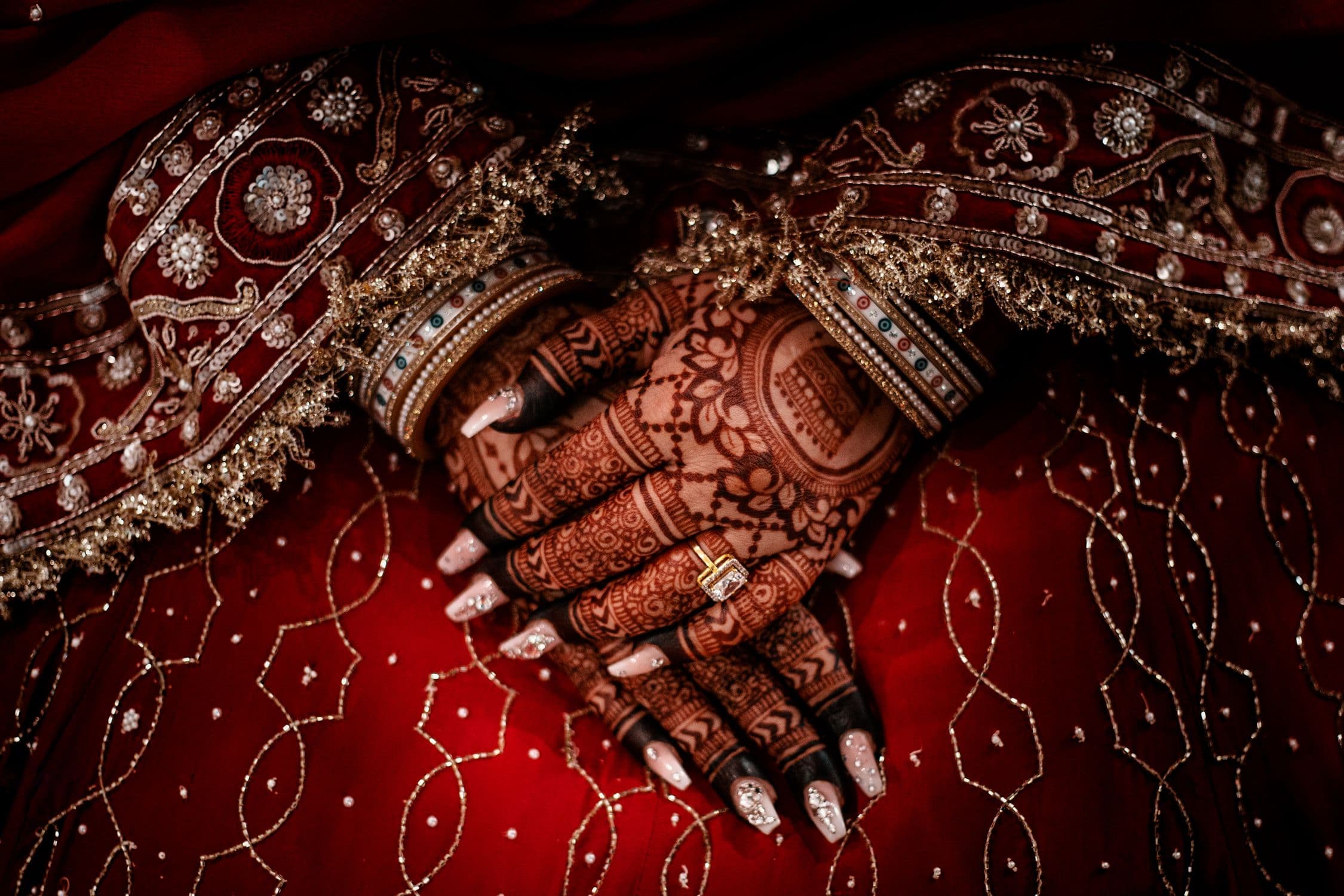 Bride's hands with intricate mehendi designs — mehendi invitation online for Indian wedding