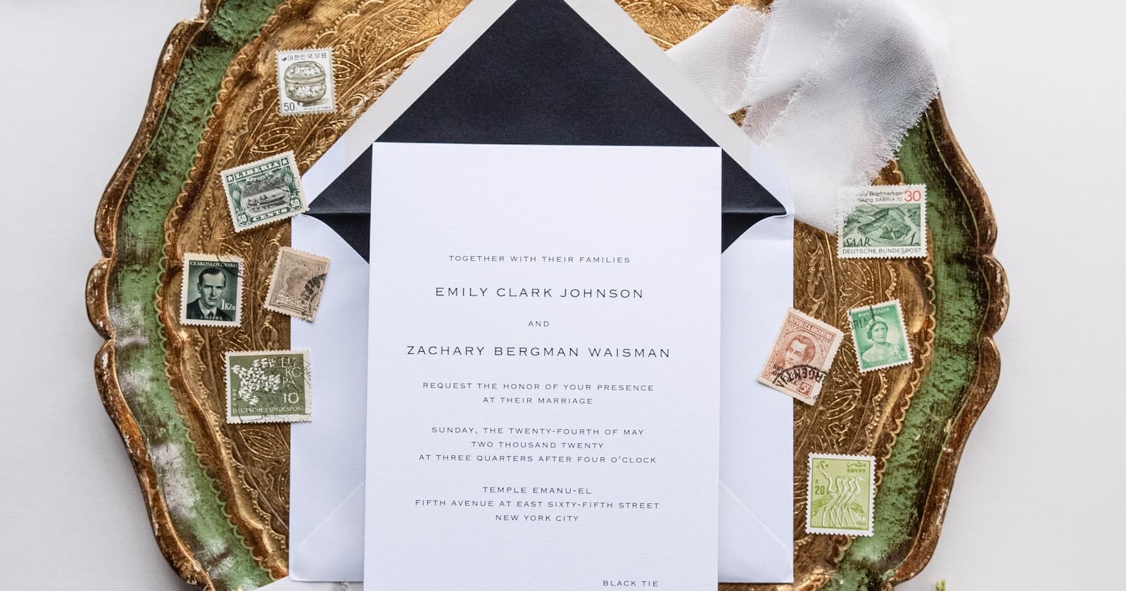 Formal wedding invitation suite on a tray, used to explain Paperless Post pricing for digital wedding invites